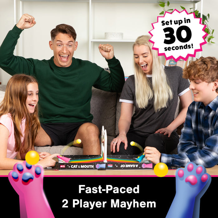 A family cheering while playing A Game of Cat & Mouth at home