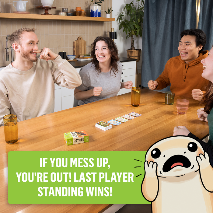 Three friends laughing while playing Coyote at a table