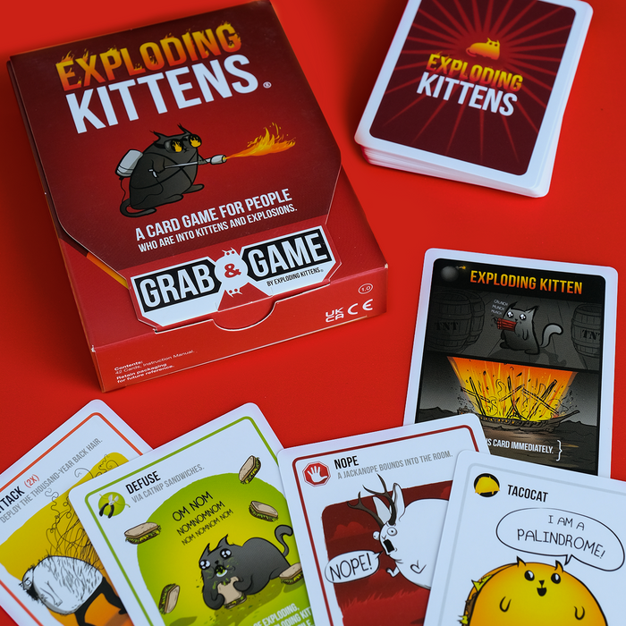 Exploding Kittens Grab & Game box with cards spread out
