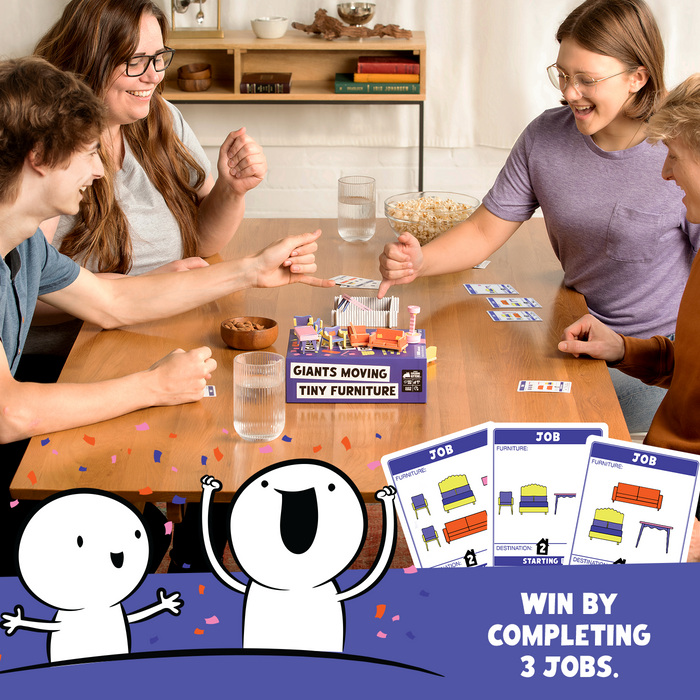 A family playing Giants Moving Tiny Furniture at a table