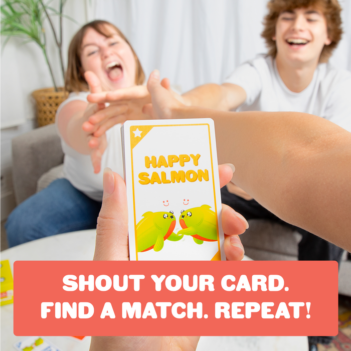 Two people playing Happy Salmon Grab & Game; shout your card and find a match