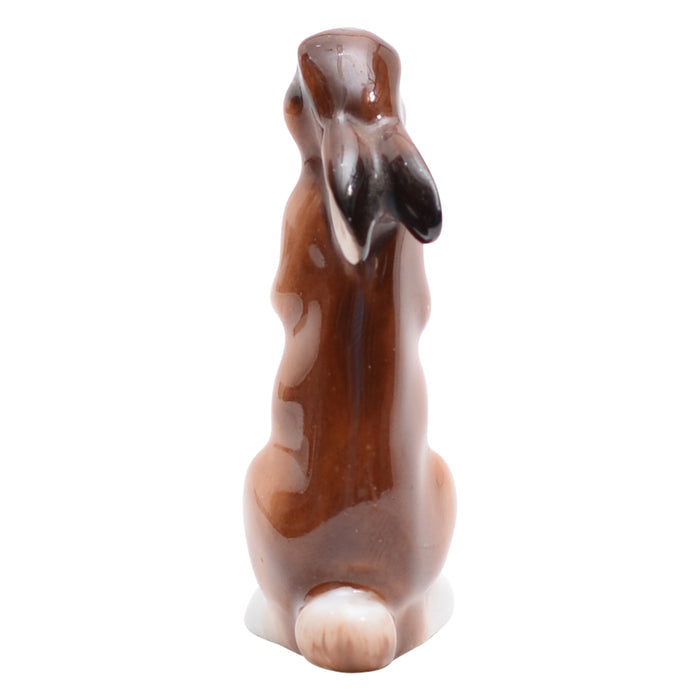 Hare seated, ears down