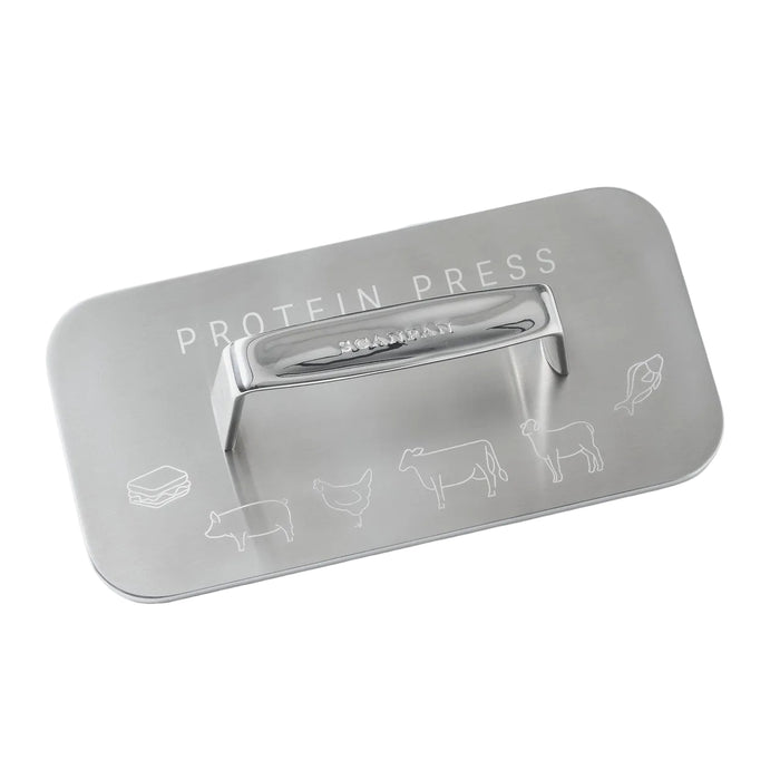 Metallic protein press tool with engraved illustrations on a white background