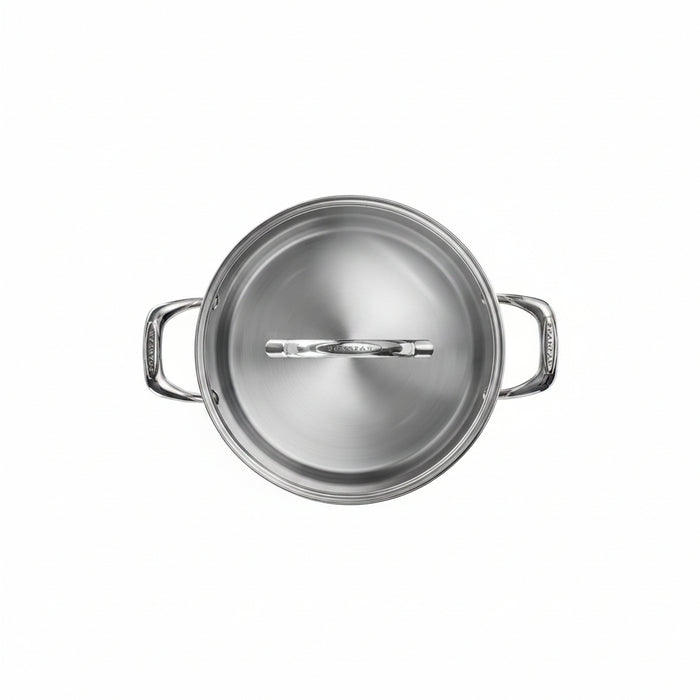 Stainless steel pot with lid on a white background
