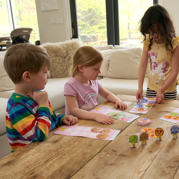 Kids playing The Best Worst Ice Cream card game at a table